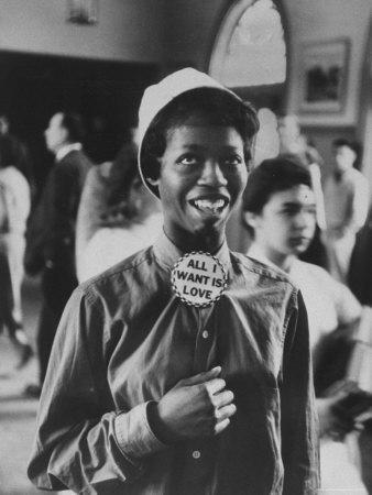 Student Wearing Hat and Button on Shirt That Says: All I Want is Love on "Old Clothes Day" - Photographic Print, 12x16 Student Wearing Hat and Button on Shirt That Says: All I Want is Love on "Old Clothes Day" - Photographic Print, 12x16