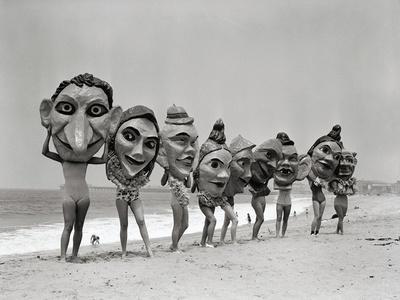Women Holding Giant Masks - Photographic Print, 12x9